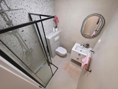 a bathroom with a shower and a sink and a mirror at Apartments by the sea Zavalatica, Korcula - 247 in Zavalatica