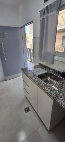 a kitchen with a sink and a counter top at Portales del Vino 2 in Tupungato