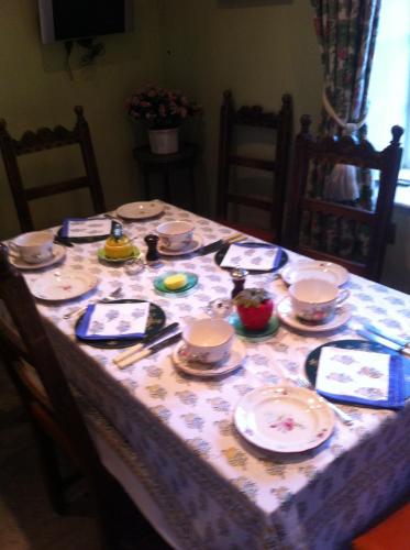 a table with plates and dishes on it at Petercott in Shepton Mallet