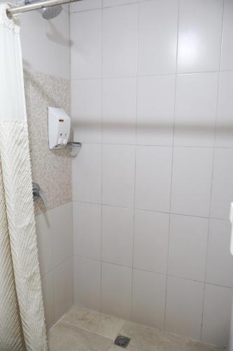 a bathroom with a shower with a shower curtain at Casa de Nelly in Puerto Baquerizo Moreno