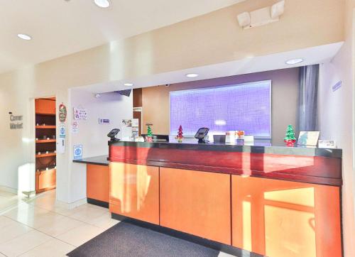 a lobby with a reception counter in a hospital at Comfort Inn & Suites Houston North - Spring in Houston