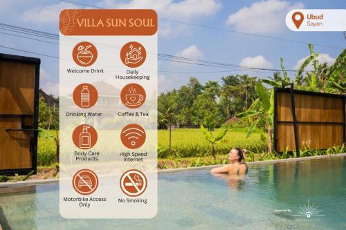 a woman in a swimming pool with a sign in it at Villa Sun Soul - Brand New 2bed Villa w Rice Field View in Ubud
