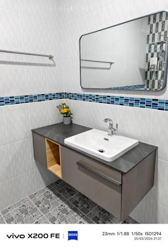 a bathroom with a sink and a mirror at Aroya Pool Villa Hatyai in Ban Thung Ri