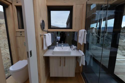 a bathroom with a sink and a shower at Tāima PurePod in Cromwell