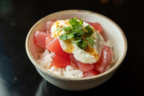 a bowl of rice with meat and vegetables on it at THE S3 Wakayama Station in Wakayama