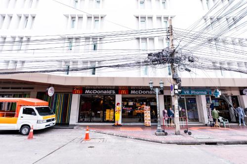 a store on the corner of a city street at Hims Room Khaosan Road in Bang Bua Thong Railway Station