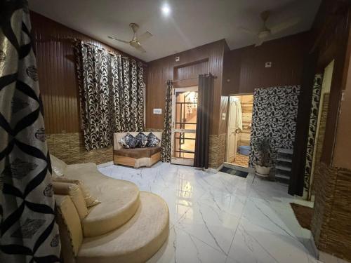 a living room with a couch and a table at Home stays in Jammu