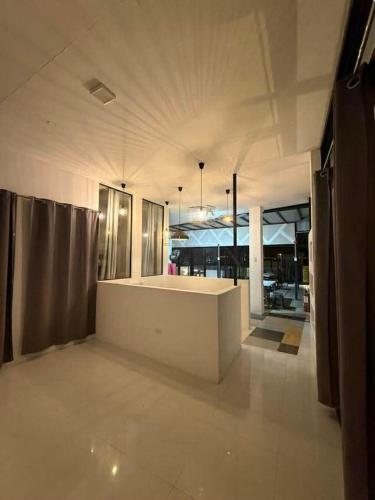 a large room with a white counter in a building at View Deck Private Pool in De La Paz