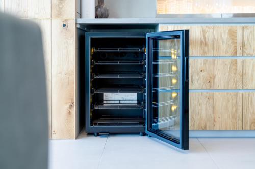 an oven with its door open in a kitchen at Villa CASK Setouchi in Mitoyo