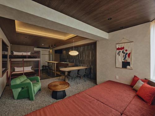 a living room with a couch and a table at illi Haku Asakusa in Tokyo