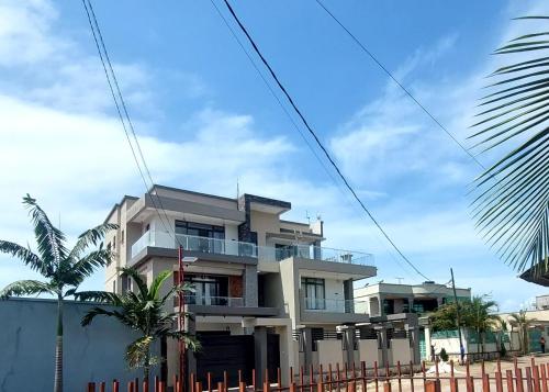 a building with a fence in front of it at Alpina Villa Hotel in Taba