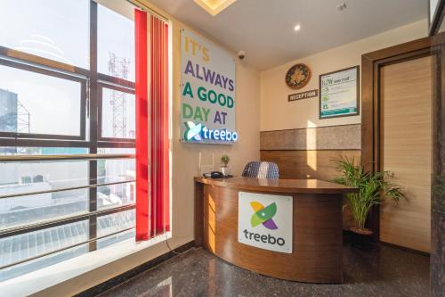 an office with a sign that reads always a good day at melbourne at Treebo Viswa Vikas Residency in Coimbatore