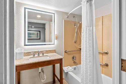 a bathroom with a sink and a shower at Comfort Suites Near Potomac Mills in Woodbridge