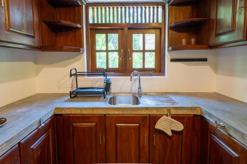 a kitchen with a sink and a window at Amara Villa in Galle