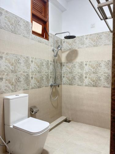 a bathroom with a toilet and a shower at Ella Heaven View in Ella