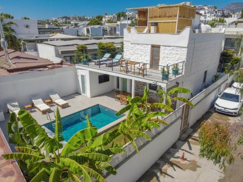 an aerial view of a house with a swimming pool at Traditional Seaside Stone Villa with Private Pool in Bodrum City