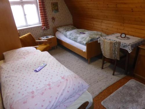 a bedroom with a bed and a table and a table and chairs at Casa Wüstner in Dinkelsbühl