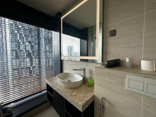 a bathroom with a bowl sink on a counter at Star Residence KLCC By BluekeyKL in Kuala Lumpur