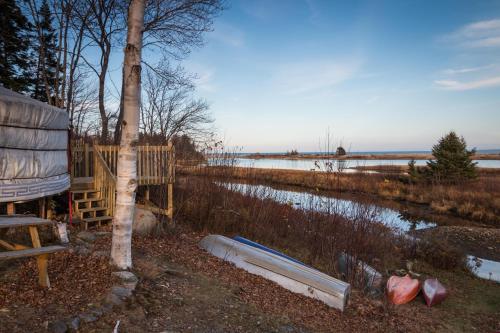 a view of a body of water next to a house at Cabot Shores in Indian Brook