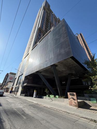 a large building on the side of a street at Departamento Centro de Monterrey junto Paseo Santa Lucia y Macroplaza in Monterrey