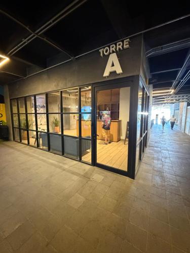 a store front with a sign that reads forever at Departamento Centro de Monterrey junto Paseo Santa Lucia y Macroplaza in Monterrey