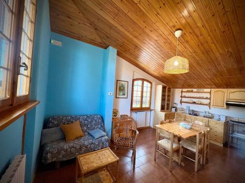 a living room with a couch and a table at Ca' di Romagna B&B in Civitella di Romagna