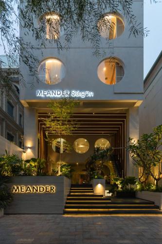 a store front of a manger with a sign on it at MEANDER Saigon in Ho Chi Minh City