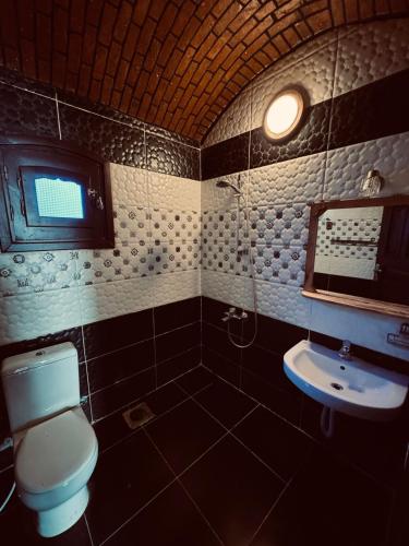 a bathroom with a toilet and a sink at Dana beach camp in Nuweiba