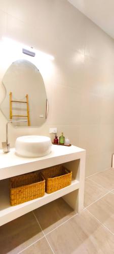 a white bathroom with a sink and a mirror at Samma Villas - Agate Villa - 1 BDR & private pool in Ko Phangan