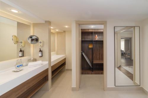 a bathroom with a sink and a mirror at Hyatt Regency Bishkek in Bishkek