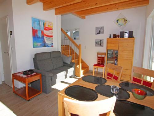 a living room with a couch and a table at Semi-detached house, Zingst in Zingst