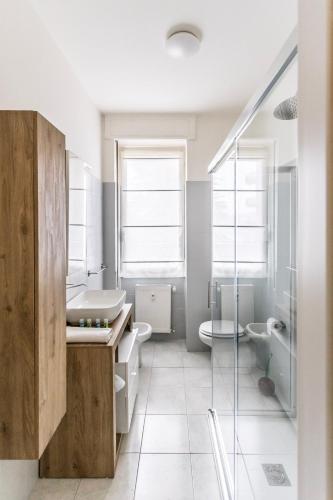 a bathroom with a sink and a toilet and a shower at Alpoggiouno in Vercurago