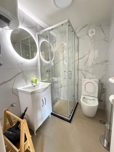 a bathroom with a shower and a toilet at Verica in Dobrota