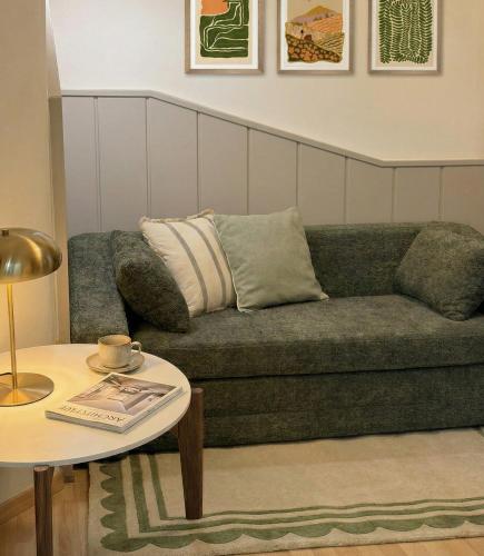 a living room with a couch and a table at Grazerhof in Graz