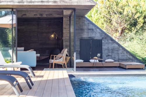 a house with a swimming pool next to a house at Casa dos Sobreiros by LovelyStay in Celorico de Basto