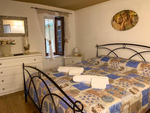 a bedroom with a bed with two pillows on it at Domus Serena in Venafro