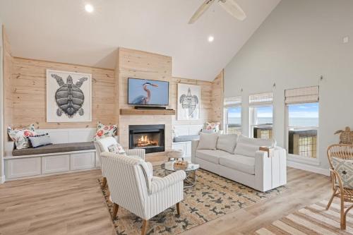 a living room with a couch and a fireplace at Gulf State home in Crystal Beach