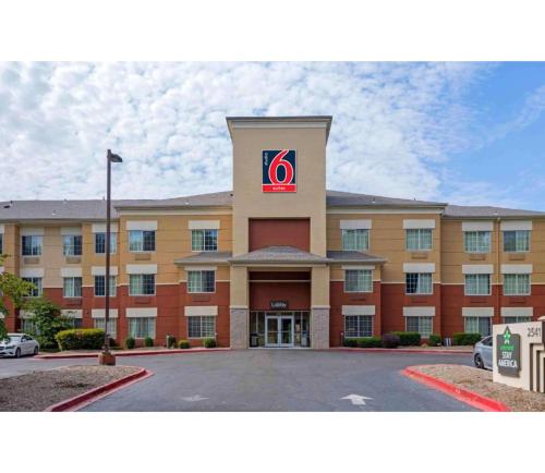 a hotel with a sign on the front of a building at Studio 6 Extended Stay Memphis Airport TN in Memphis