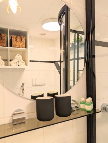 a bathroom with a sink and a mirror at Loft in Weiler in Weiler