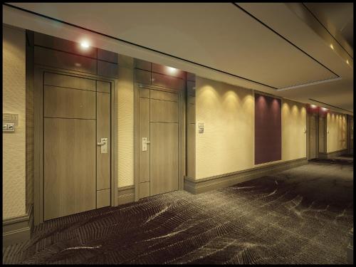 a row of elevators in a hallway of a building at Amari Johor Bahru in Johor Bahru