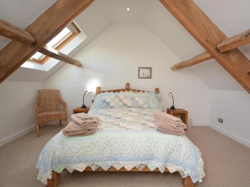 a bedroom with a bed in the attic at 2 Bed in Blagdon oc-tforg in Butcombe