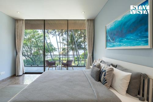 StayVista at Sapphire Shores Beachfront Villa with Lawn, Pool