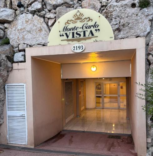 a entrance to a hotel with a stone wall at Monte Carlo Vista in Beausoleil