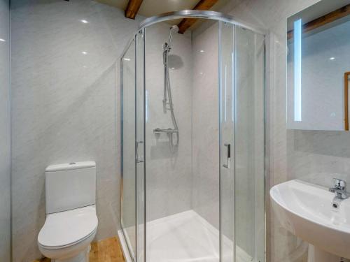 a bathroom with a shower and a toilet and a sink at 2 Bed in Lancaster oc-82857 in Beetham