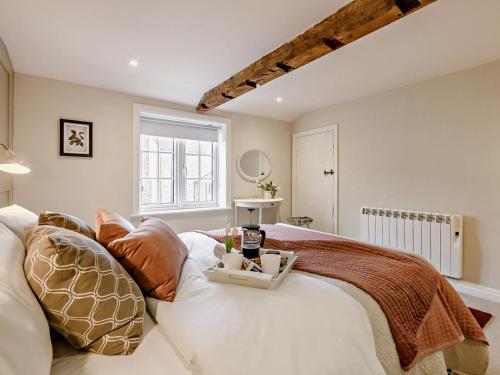 a bedroom with a bed with a tray on it at 2 Bed in York oc-90906 in Sheriff Hutton