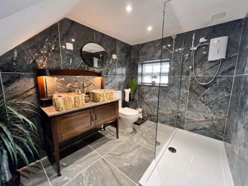 a bathroom with a sink and a toilet and a shower at 2 Bed in Hexham oc-88214 in Yarrow