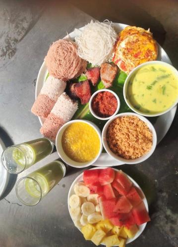 a plate of food with different types of food at Wanora Eco Villa in Dickwella