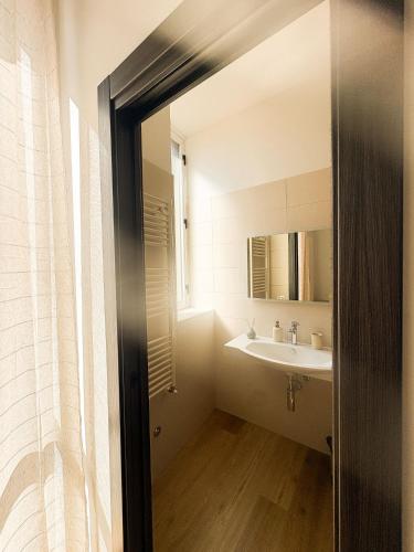 a bathroom with a sink and a mirror at Le Tre Lune Rooms in Matera