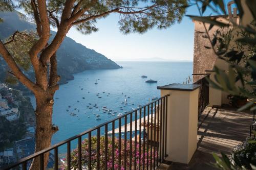 a view of the ocean from a balcony of a house at Casa Sam Positano in Positano