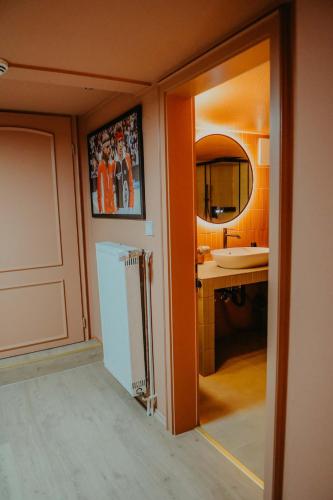 a bathroom with a sink and a mirror at sleepArt match point in Celle